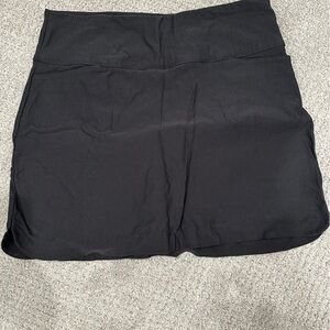 Black golf/ tennis skirt. Worn once. Front and back pockets